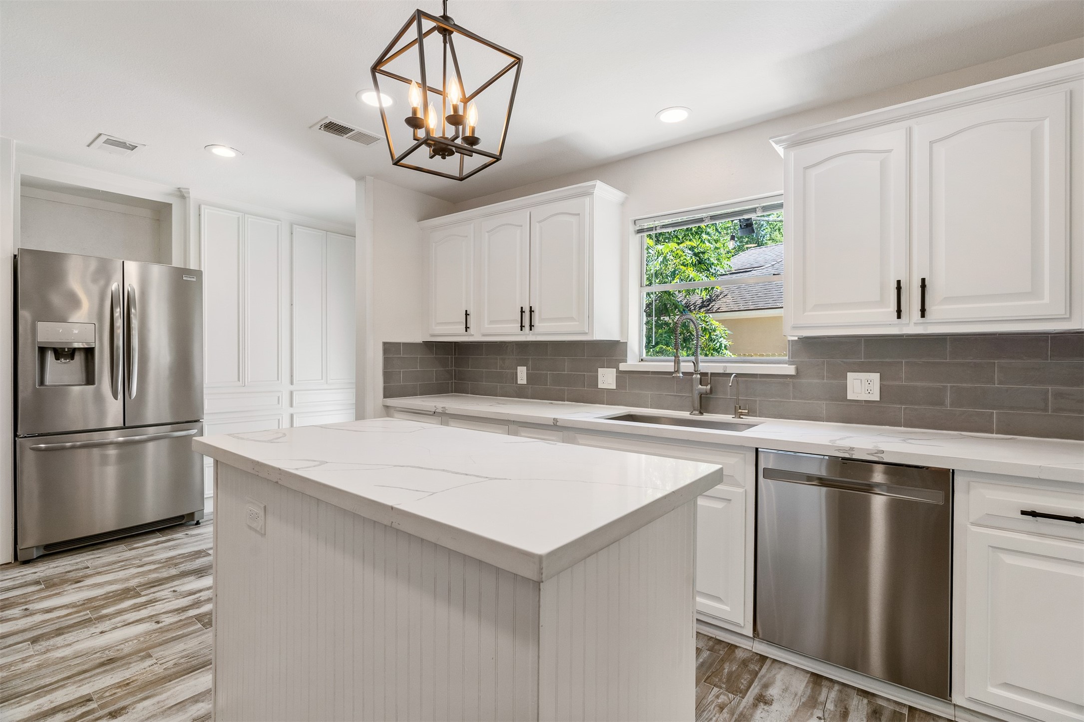 3219 Chippers Crossing Montgomery, TX 77356 - Photo 9 of 35 a kitchen with a refrigerator a sink and cabinets