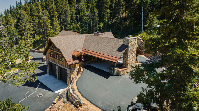 1667 West Tollgate Cyn Road Coalville, UT 84017 - Photo 60 of 61 Expansive property featuring a stone and wood-sided architectural style, a multi-car garage, and a large paved driveway