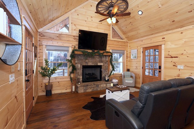 956 Lemmon Lane Ellijay, GA 30540 - Photo 11 of 60 a living room with furniture a flat screen tv and a fireplace