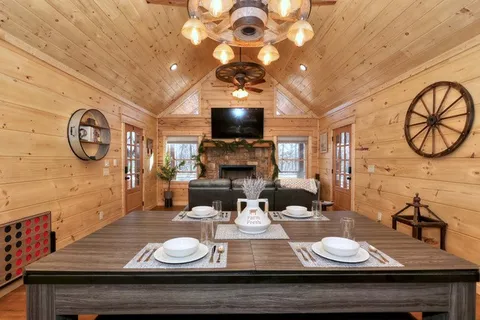 a kitchen with stainless steel appliances a stove a sink dishwasher and cabinets with wooden floor