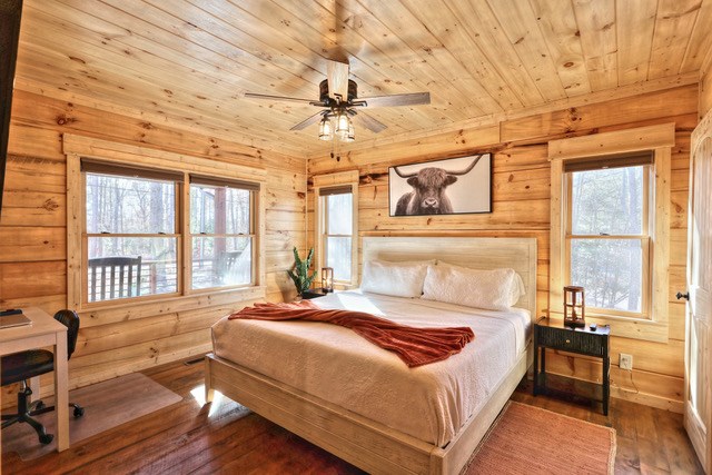 956 Lemmon Lane Ellijay, GA 30540 - Photo 24 of 60 a bedroom with a bed wooden floor and window