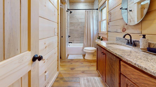 956 Lemmon Lane Ellijay, GA 30540 - Photo 28 of 60 a bathroom with a granite countertop sink a toilet and a mirror