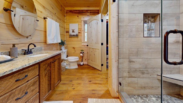 956 Lemmon Lane Ellijay, GA 30540 - Photo 29 of 60 a bathroom with a granite countertop sink mirror and shower