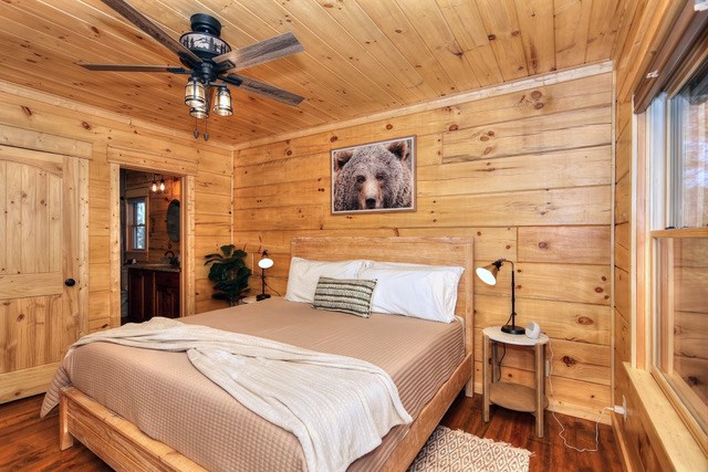 956 Lemmon Lane Ellijay, GA 30540 - Photo 33 of 60 a bedroom with a bed and a chandelier