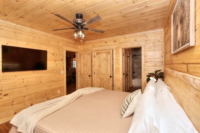 956 Lemmon Lane Ellijay, GA 30540 - Photo 34 of 60 a bedroom with a bed and a flat screen tv