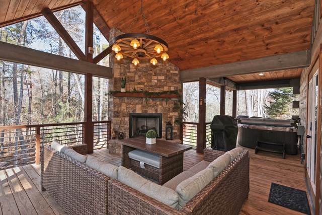 956 Lemmon Lane Ellijay, GA 30540 - Photo 38 of 60 a living room with furniture a fireplace and windows