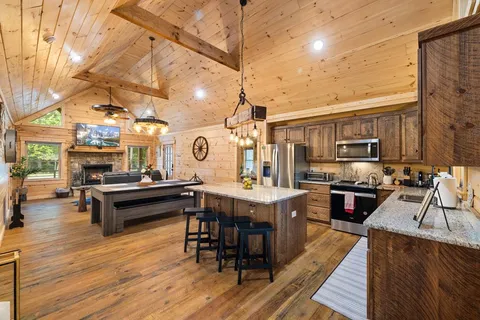 a bathroom with a granite countertop sink mirror and shower