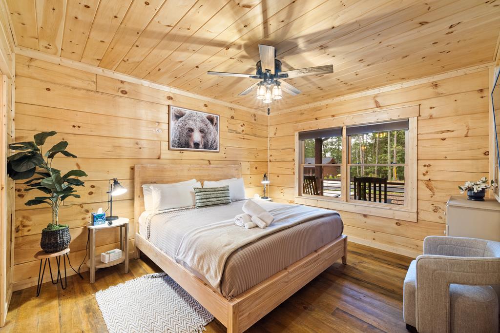 956 Lemmon Lane Ellijay, GA 30540 - Photo 46 of 60 a bedroom with a bed and wooden floor