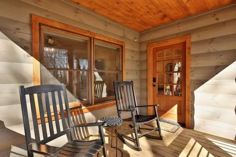 a living room with fireplace furniture and a wooden floor