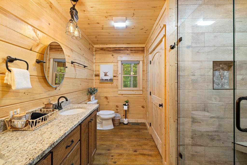 956 Lemmon Lane Ellijay, GA 30540 - Photo 53 of 60 a bathroom with a granite countertop sink mirror and shower