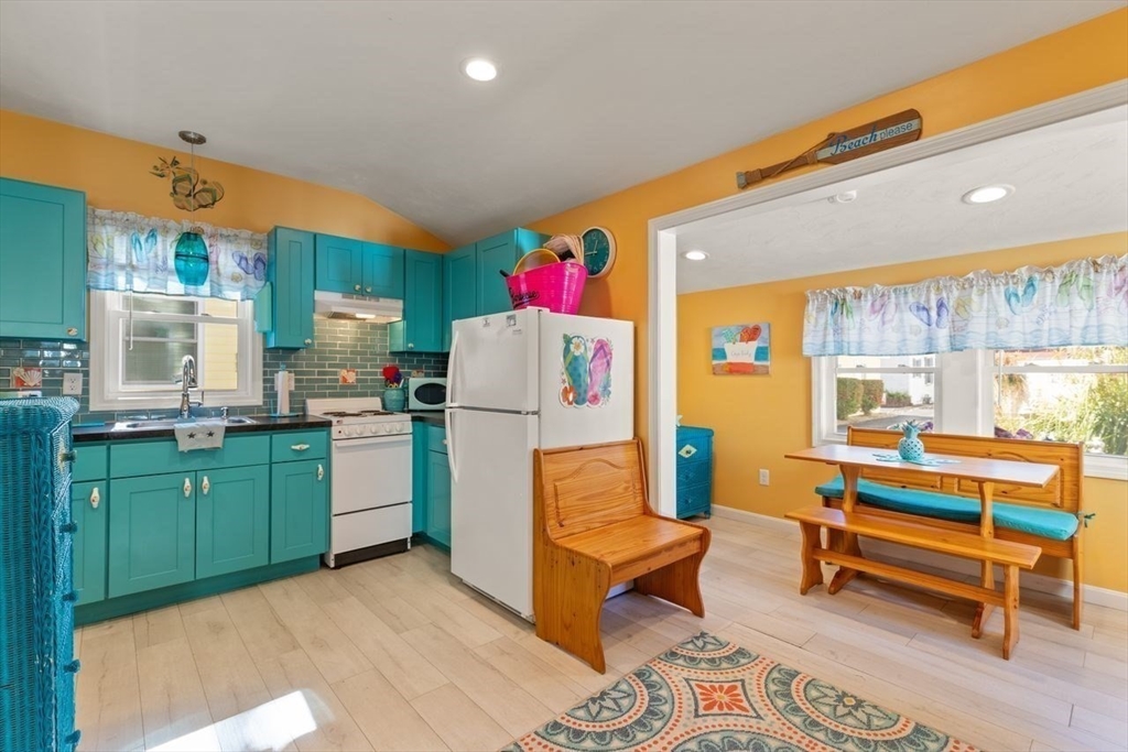 66 Bayview Street Wareham, MA 02571 - Photo 13 of 37 a living room with furniture and a kitchen area