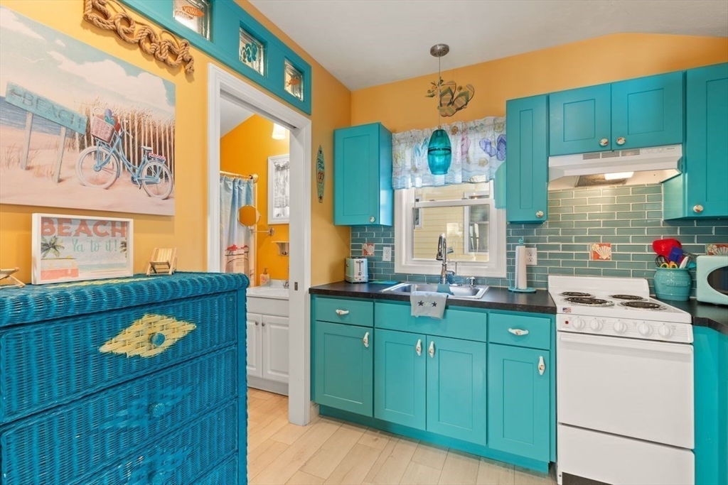 66 Bayview Street Wareham, MA 02571 - Photo 14 of 37 a kitchen with a cabinets and wooden floor