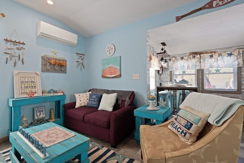 66 Bayview Street Wareham, MA 02571 - Photo 17 of 37 a living room with furniture and a table