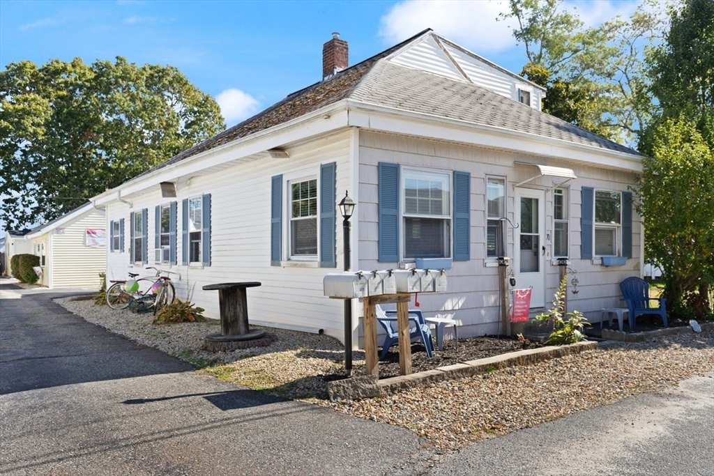 66 Bayview Street Wareham, MA 02571 - Photo 2 of 37 a front view of a house with sitting area