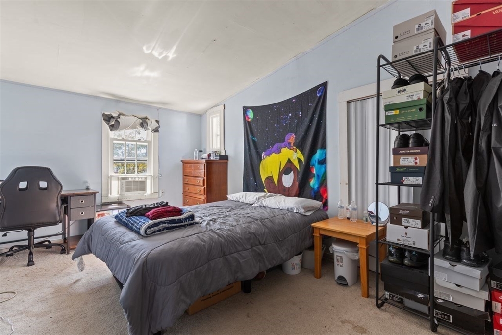 66 Bayview Street Wareham, MA 02571 - Photo 32 of 37 a bedroom with a bed and a desk