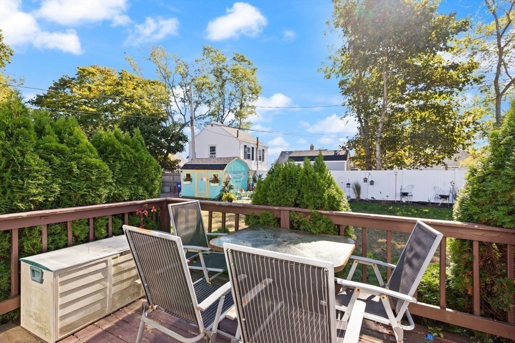 66 Bayview Street Wareham, MA 02571 - Photo 35 of 37 a view of a chairs and table on the deck