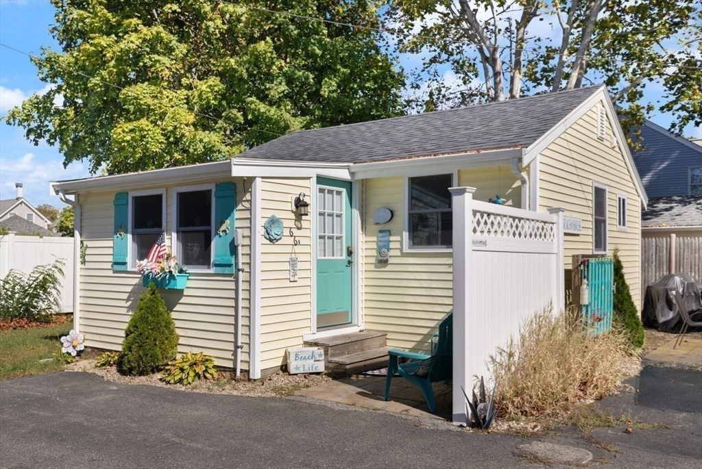 66 Bayview Street Wareham, MA 02571 - Photo 5 of 37 a view of a house with a yard and garage