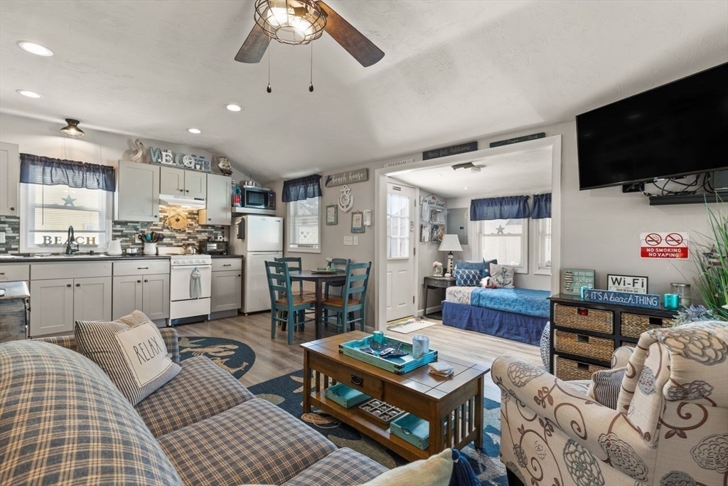 66 Bayview Street Wareham, MA 02571 - Photo 8 of 37 a living room with furniture and a flat screen tv