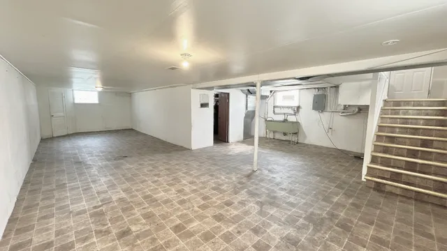 en empty room with a white walls and closet