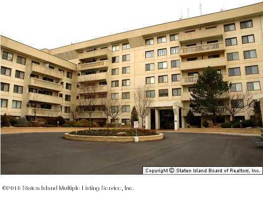 a black and white building with a street