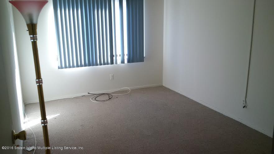 5 Windham Loop, Unit 1J Staten Island, NY 10314 - Photo 3 of 8 a view of empty room