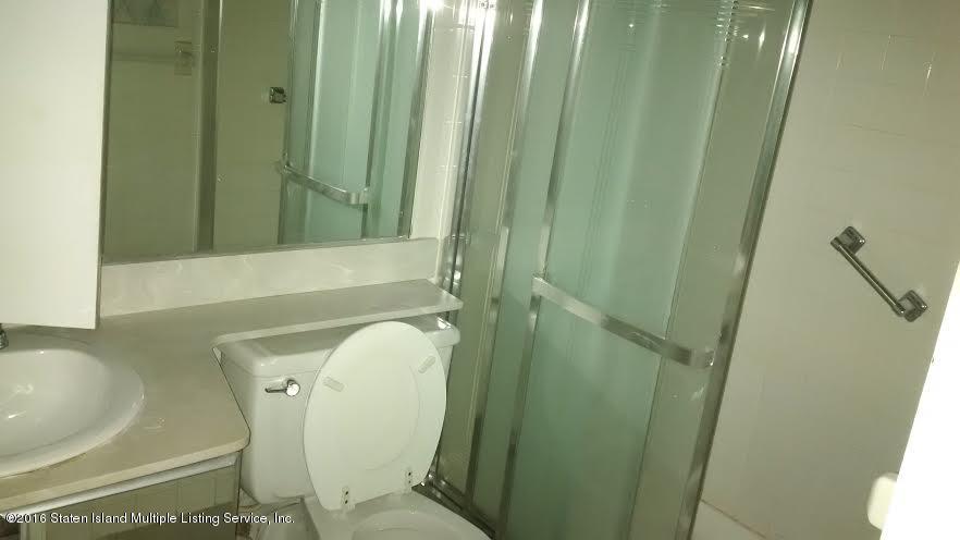 5 Windham Loop, Unit 1J Staten Island, NY 10314 - Photo 7 of 8 a bathroom with a sink a toilet and shower