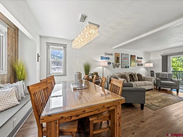 a living room with furniture and a table