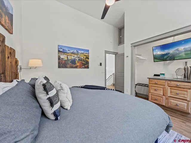 a bedroom with a bed and a dresser