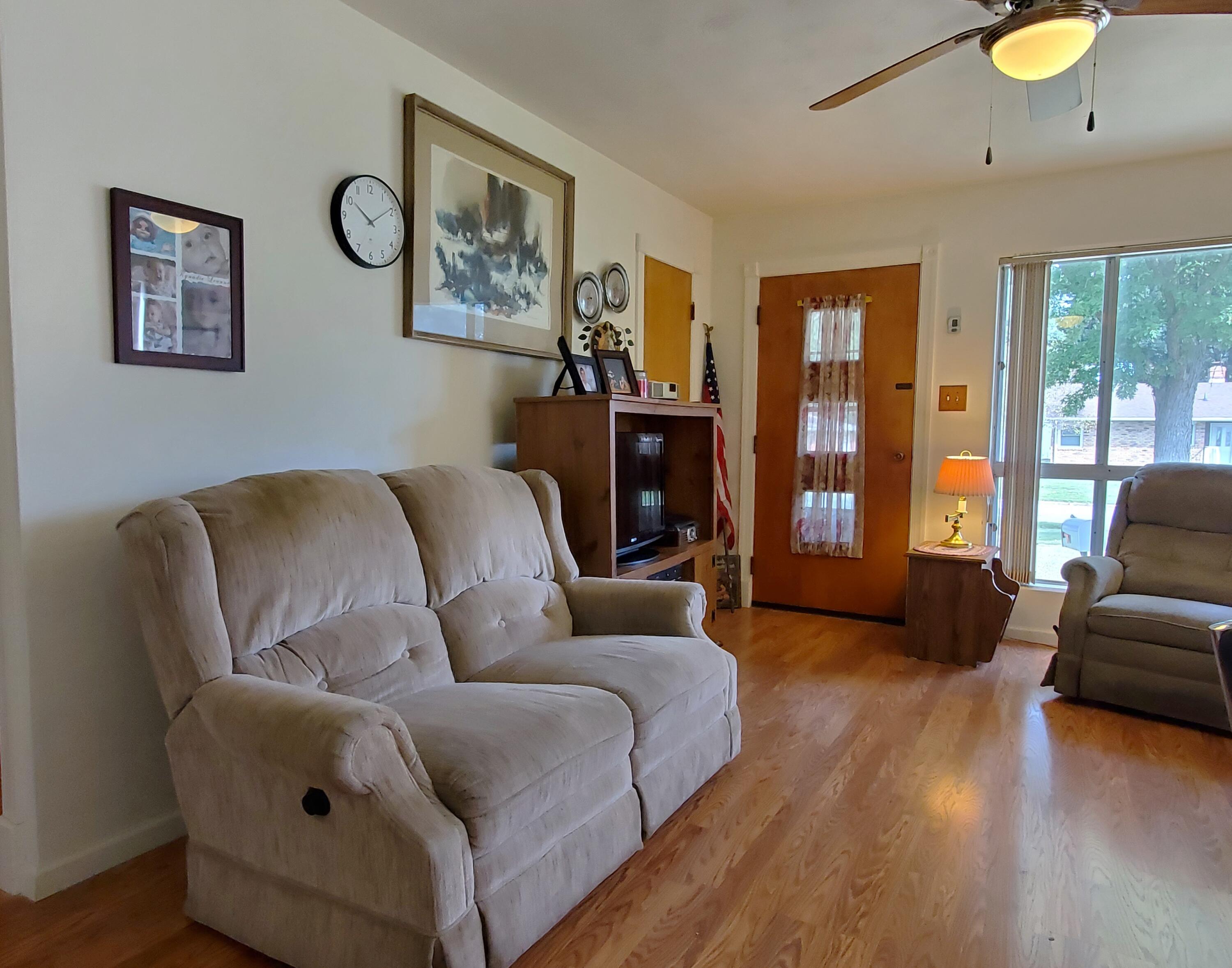 805 West Washington Street Rensselaer, IN 47978 - Photo 5 of 15 a living room with furniture and a floor to ceiling window