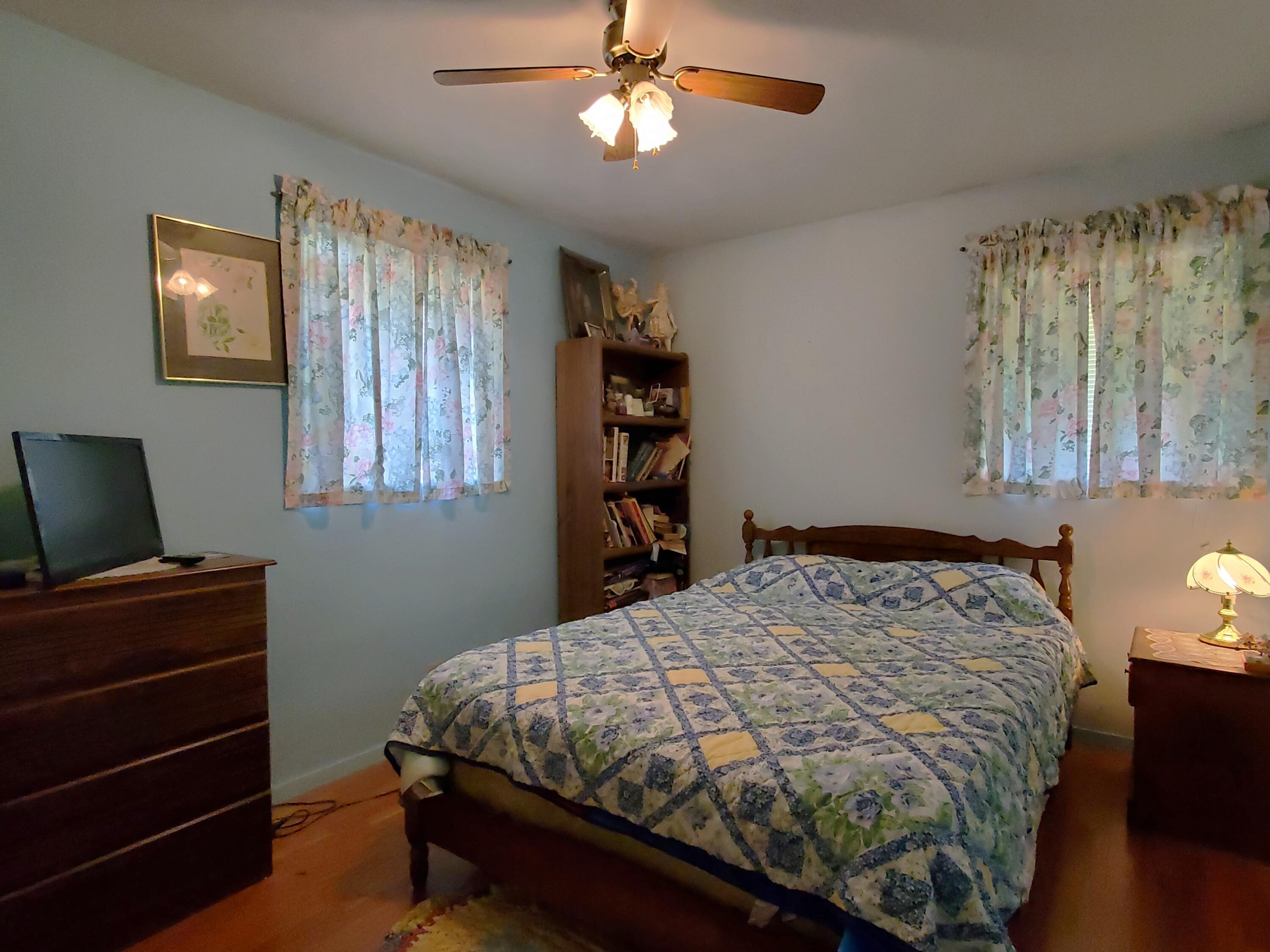 805 West Washington Street Rensselaer, IN 47978 - Photo 10 of 15 a bedroom with a bed and a chandelier