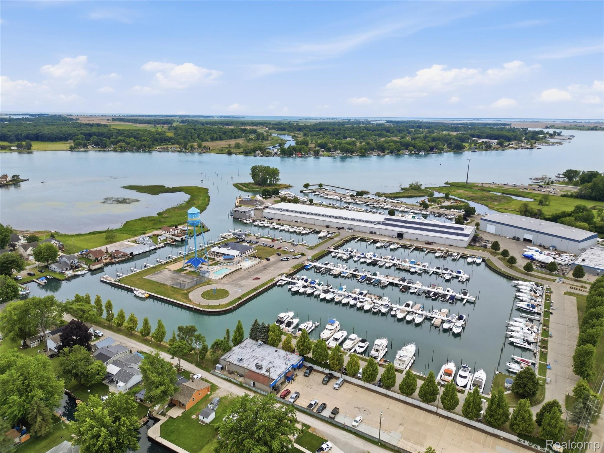 117 Kenyon Road Algonac, MI 48001 - Photo 10 of 47 Expansive marina featuring multiple boat slips, boat storage facilities, and a large body of water