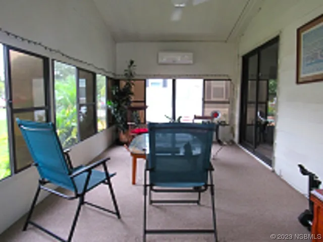 a view of a dining room with furniture window and outside view