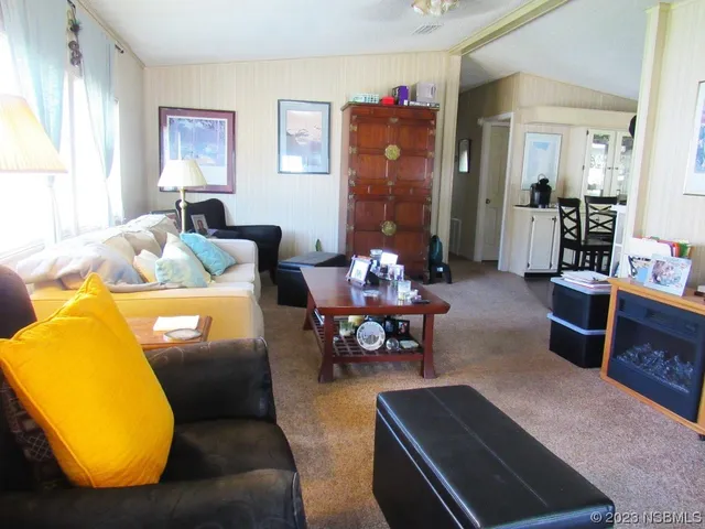 a living room with furniture and a table