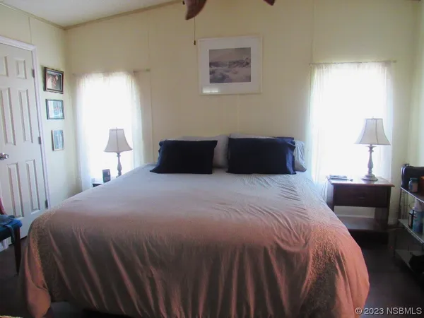 a bedroom with a bed and a couch