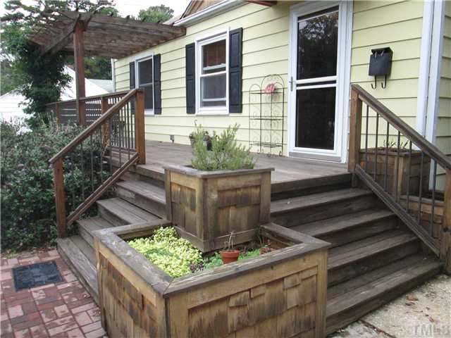 207 Plainview Avenue Raleigh, NC 27604 - Photo 2 of 25 Current owners added this front porch at a cost of approx. $7500.00! VERY nice with bench seating, planter boxes, iron/aluminum style pickets made to last! Really adds to the charm of this already cute home/Bungalow!
