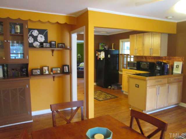 207 Plainview Avenue Raleigh, NC 27604 - Photo 15 of 25 From dining room just showing how open this plan is! Custom built ins and shelving as well! To the left in this photos leads you to the guest full bath and bedrooms!