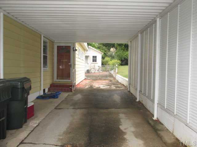 207 Plainview Avenue Raleigh, NC 27604 - Photo 4 of 25 Very nice and large carport with entry into the home! Extra wide for storage of whatever you need and leads into the fenced in backyard area! Top notch carport on great shape offering some privacy on the side!