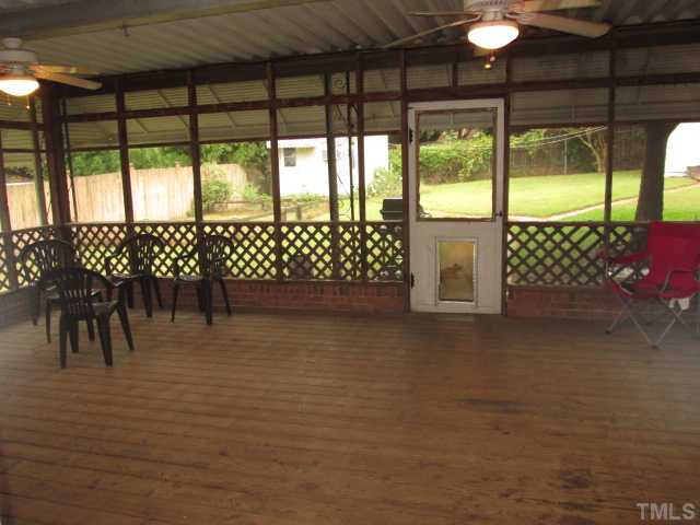 207 Plainview Avenue Raleigh, NC 27604 - Photo 10 of 25 HUGE screen porch with low brick walls around the bottom! Two ceiling fans with light kits! Door to back yard with pet door! Its rare to see any screen porch this large, but what a great area!! Could add a TV, wet bar, make many uses of this space!