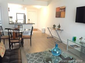 185 Southeast 14th Terrace, Unit 802 Miami, FL 33131 - Photo 11 of 19 a dining room with furniture and window