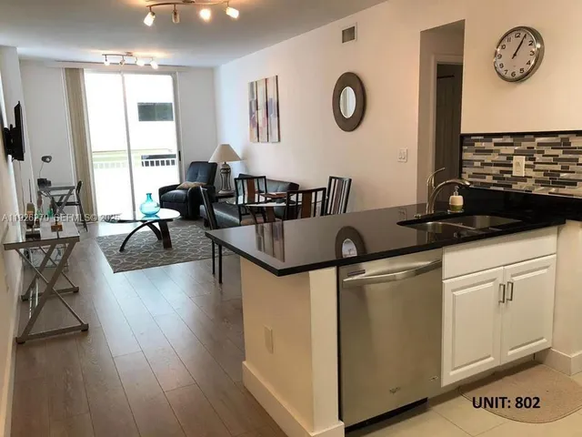 a view of living room with furniture and window