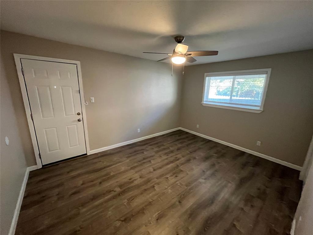 5827 Columbia Avenue Dallas, TX 75214 - Photo 11 of 15 a view of empty room with wooden floor