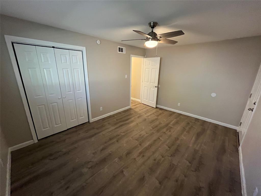 5827 Columbia Avenue Dallas, TX 75214 - Photo 12 of 15 a view of an empty room with a chandelier fan