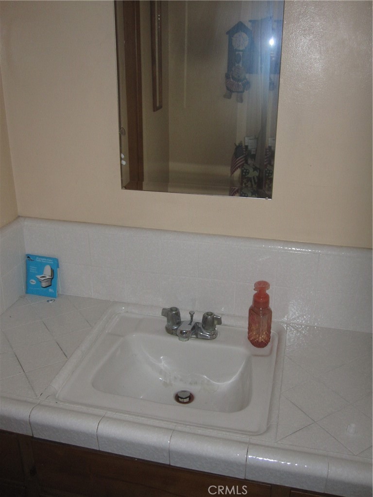 8532 Cedar Drive Buena Park, CA 90620 - Photo 16 of 40 a bathroom with a sink and a window