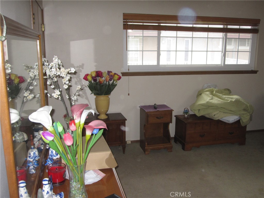 8532 Cedar Drive Buena Park, CA 90620 - Photo 2 of 40 a dining room filled with furniture and flowers