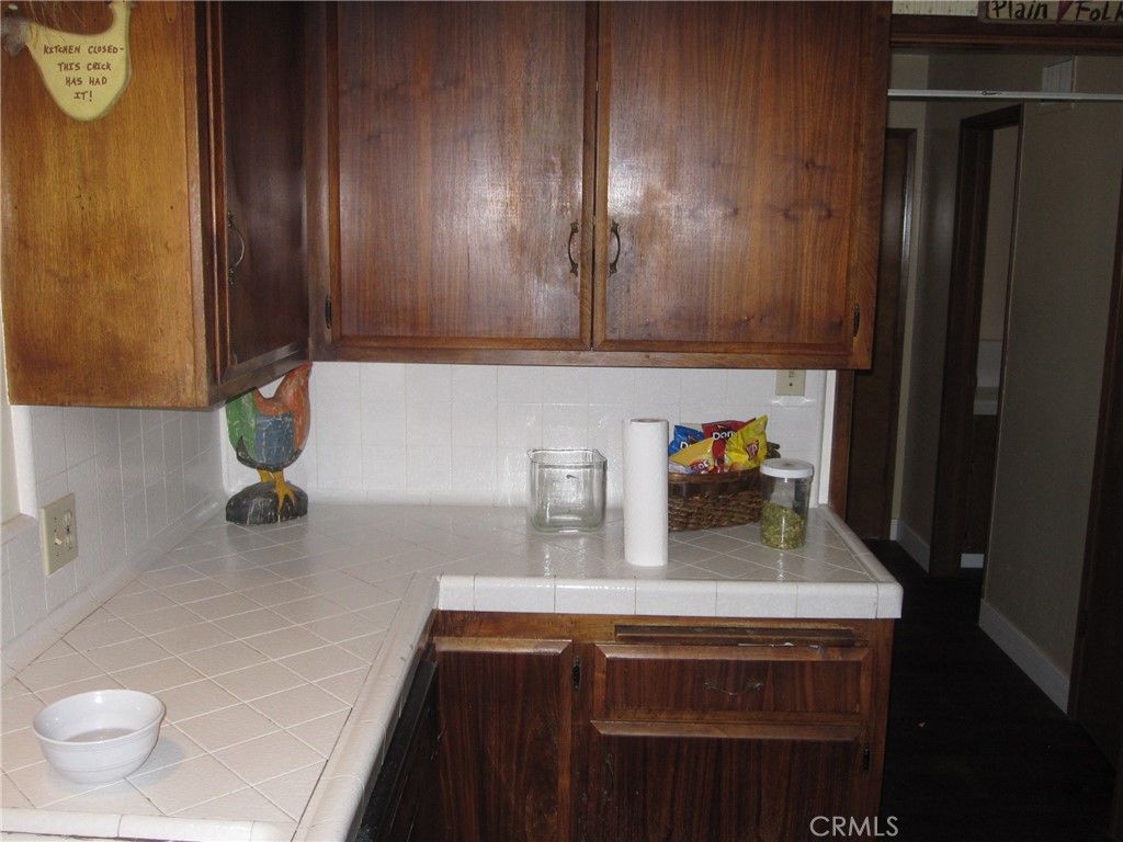 8532 Cedar Drive Buena Park, CA 90620 - Photo 21 of 40 a kitchen with a sink and a stove