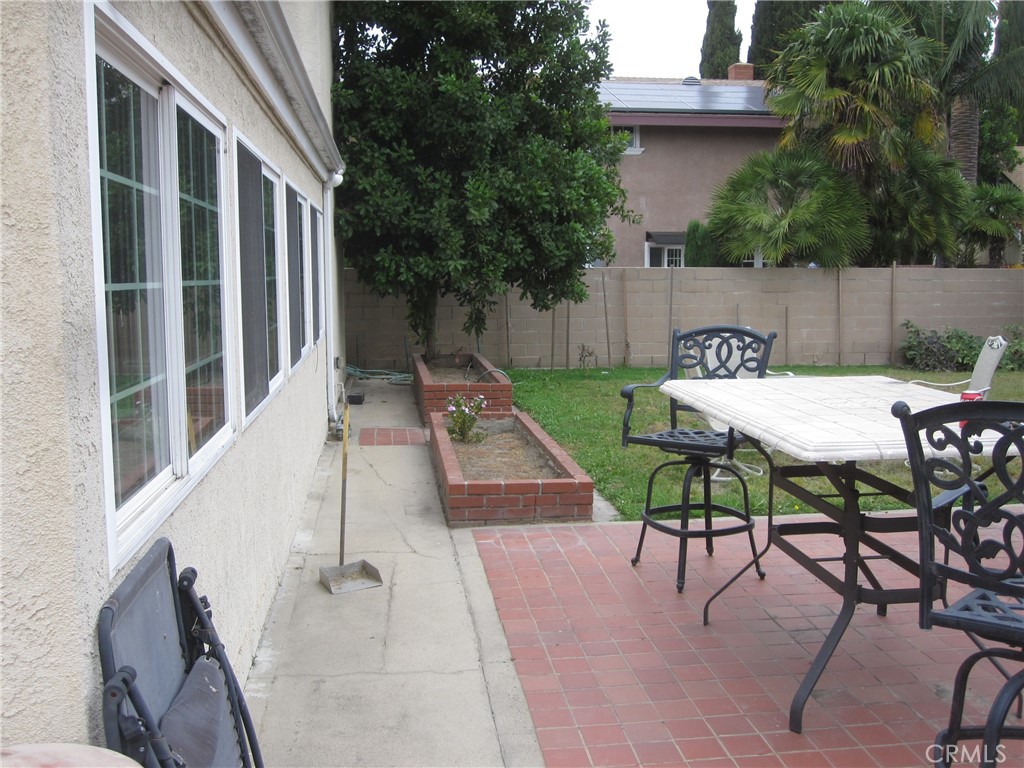 8532 Cedar Drive Buena Park, CA 90620 - Photo 30 of 40 a backyard of a house with table and chairs