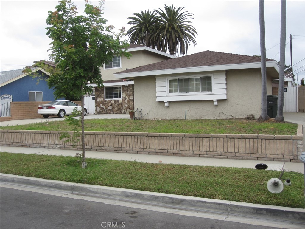 8532 Cedar Drive Buena Park, CA 90620 - Photo 39 of 40 a front view of a house with a garden and plants