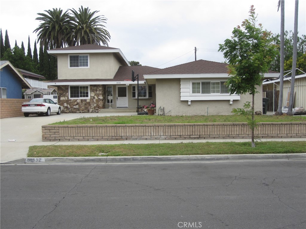 8532 Cedar Drive Buena Park, CA 90620 - Photo 40 of 40 a front view of a house with a garden and trees