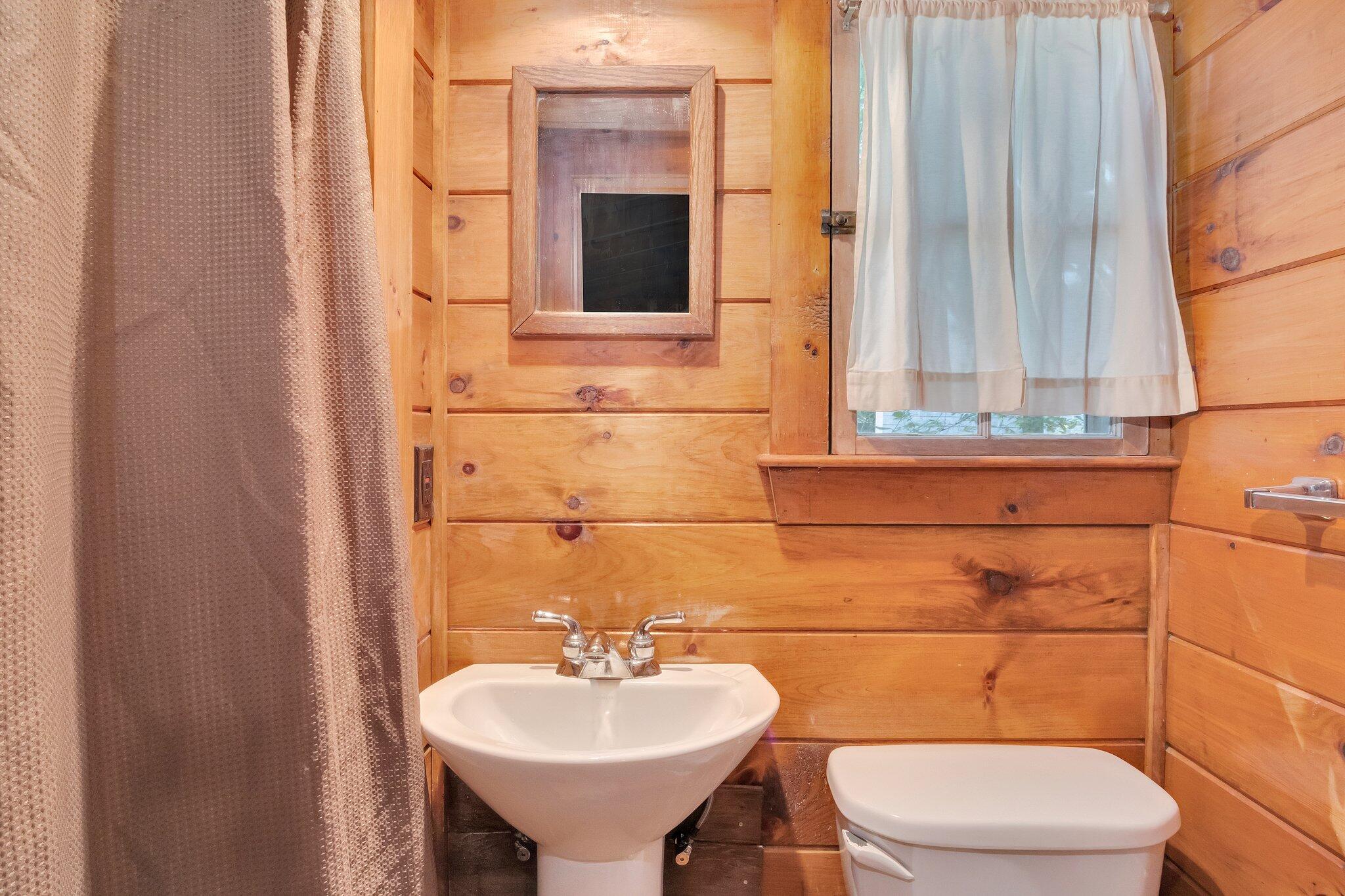1975 State Highway, Unit 9 Eastham, MA 02642 - Photo 12 of 23 a bathroom with a toilet sink and mirror