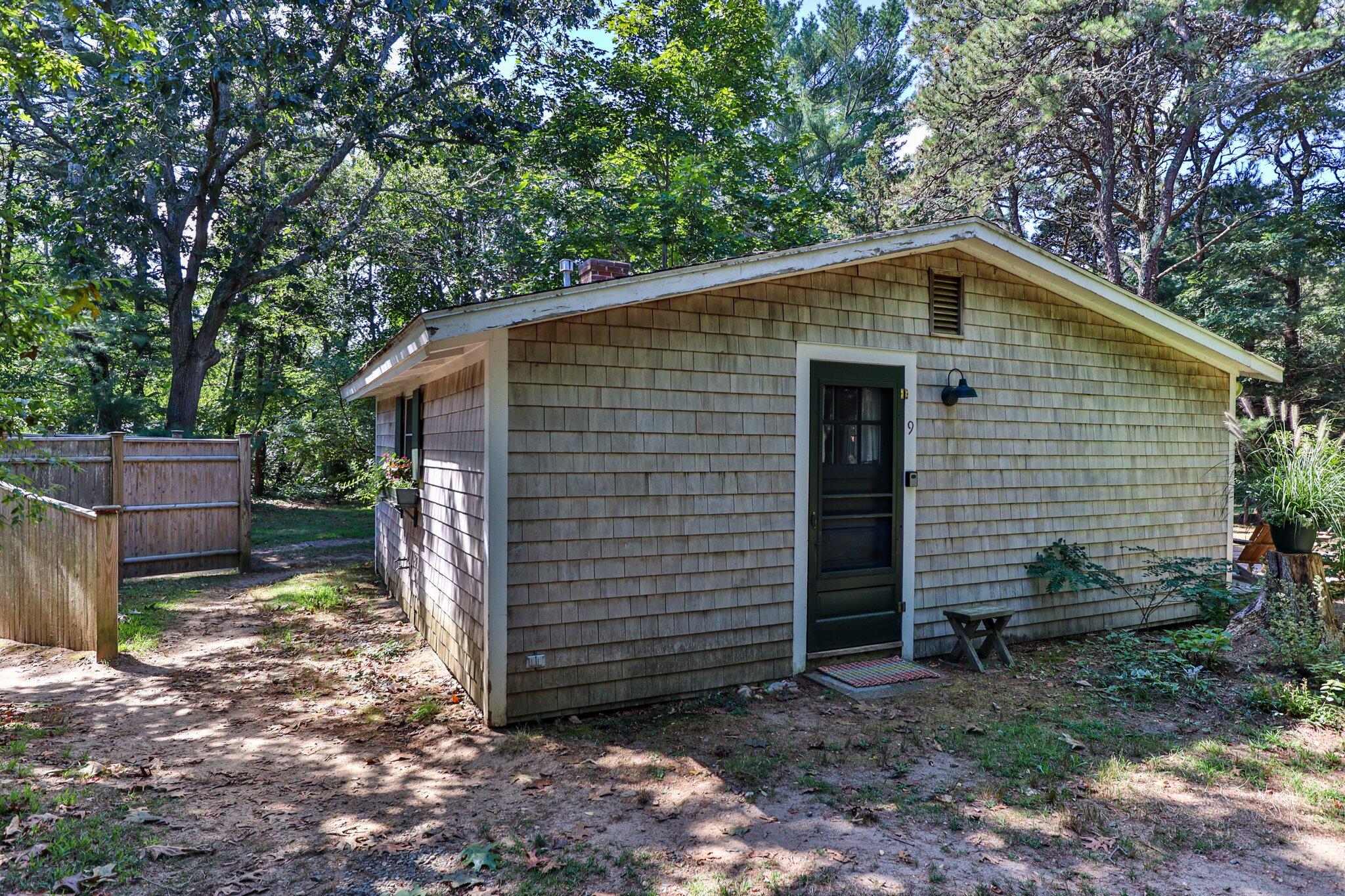 1975 State Highway, Unit 9 Eastham, MA 02642 - Photo 18 of 23 a front view of a house with a yard